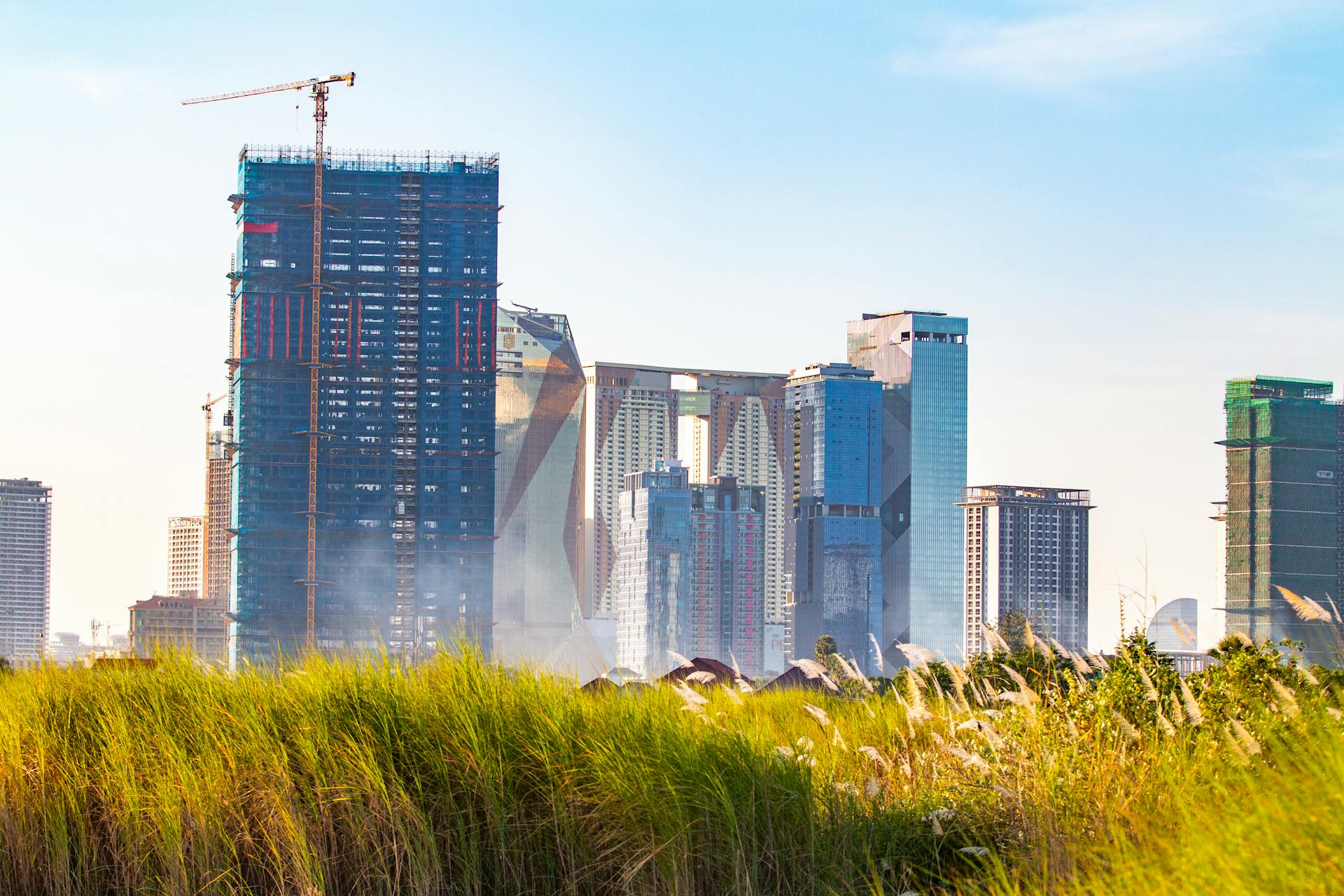 A view of the emerging skyline in Phnom Penh with modern skyscrapers under construction.