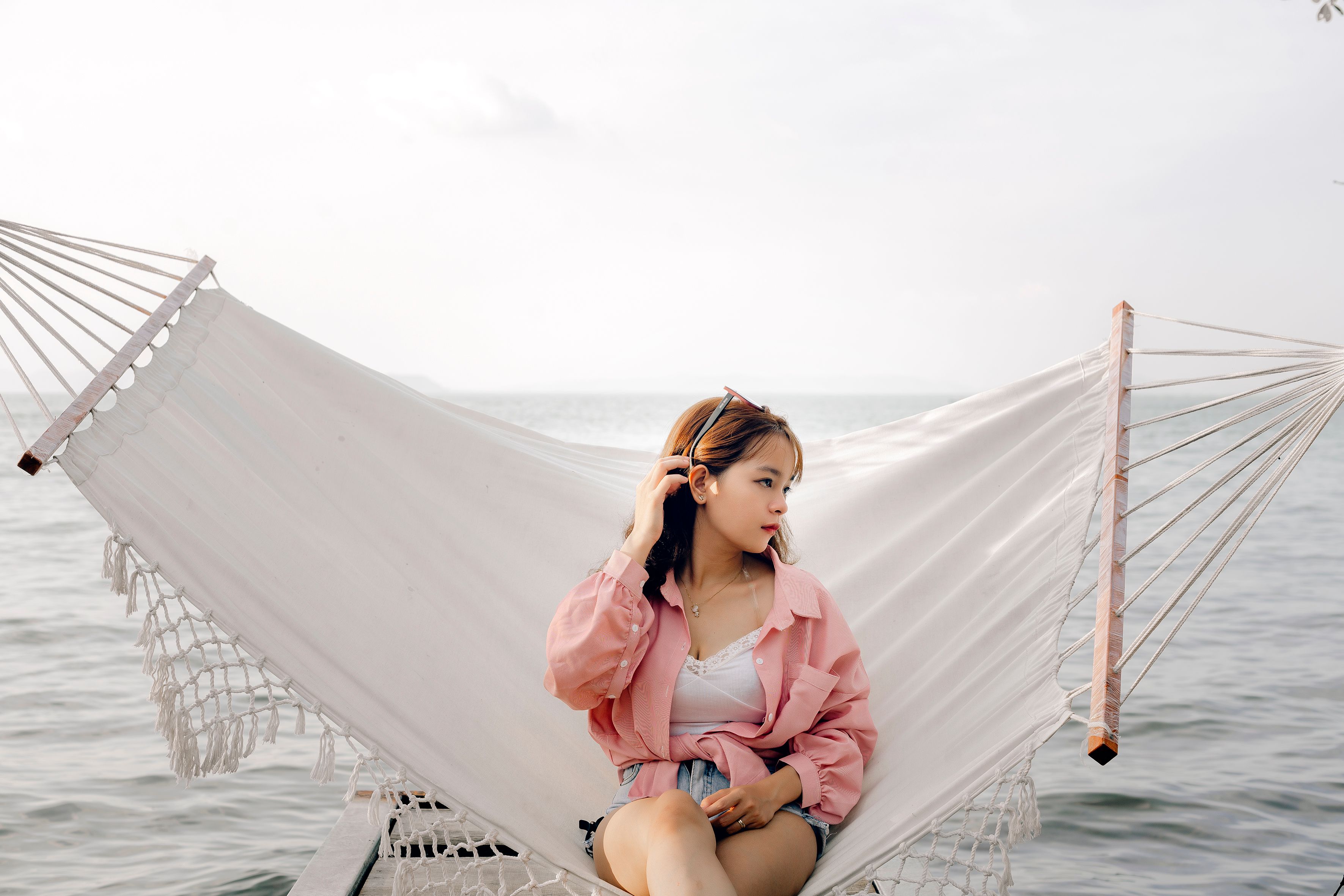 Young Woman Relaxing on Hammock by the Sea · Free Stock Photo