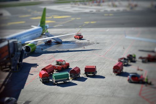 Airplane and Vehicles on Airport Tarmac