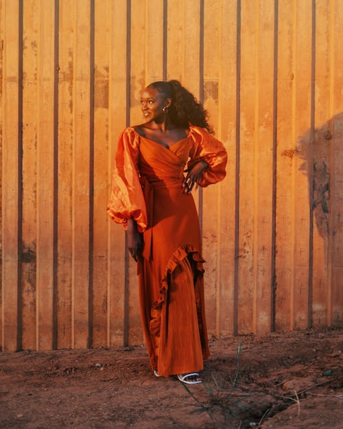 Smiling Woman in Orange Dress