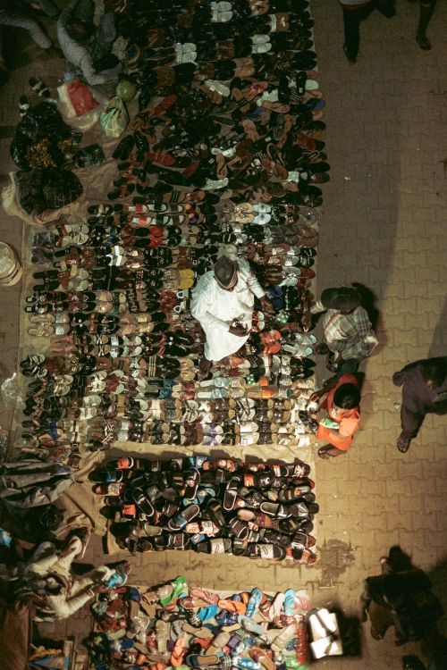 Free Aerial view of a street shoe vendor on a busy market sidewalk in Abuja, Nigeria. Stock Photo