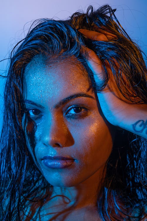 A Model with Wet Hair in Blue and Purple Lights