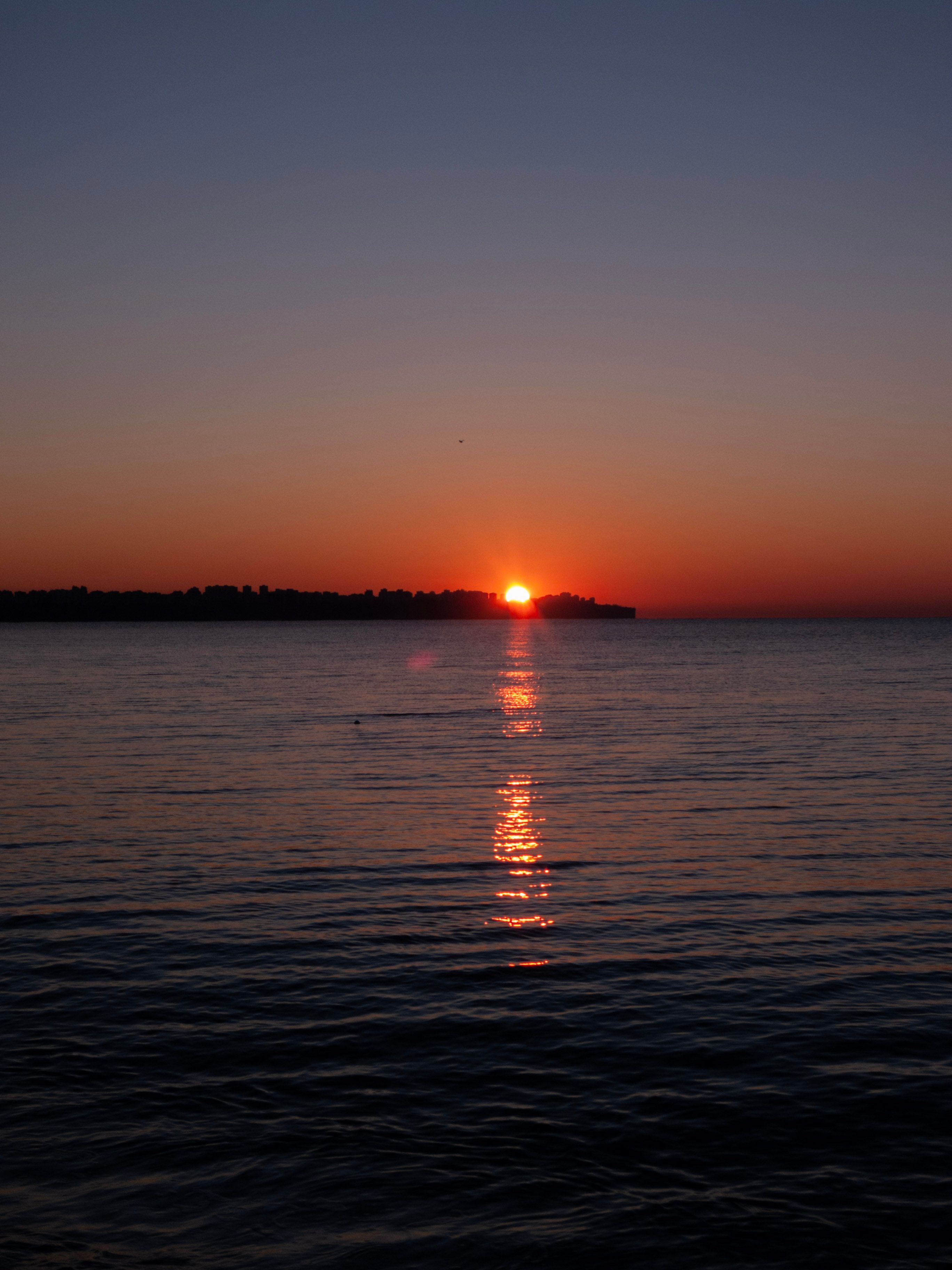Yellow Sky over Sea at Sunset · Free Stock Photo