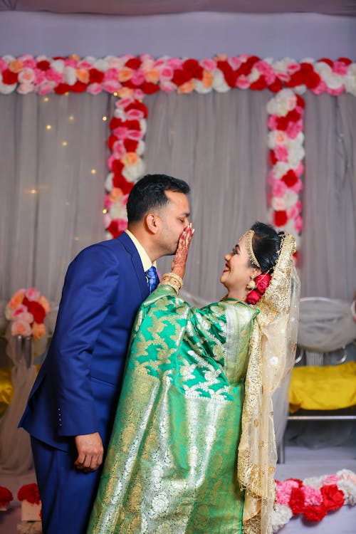 Smiling Newlyweds in Traditional Clothing