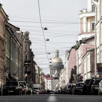 Scenic view of St. Petersburg street with St. Isaac's Cathedral in the background.