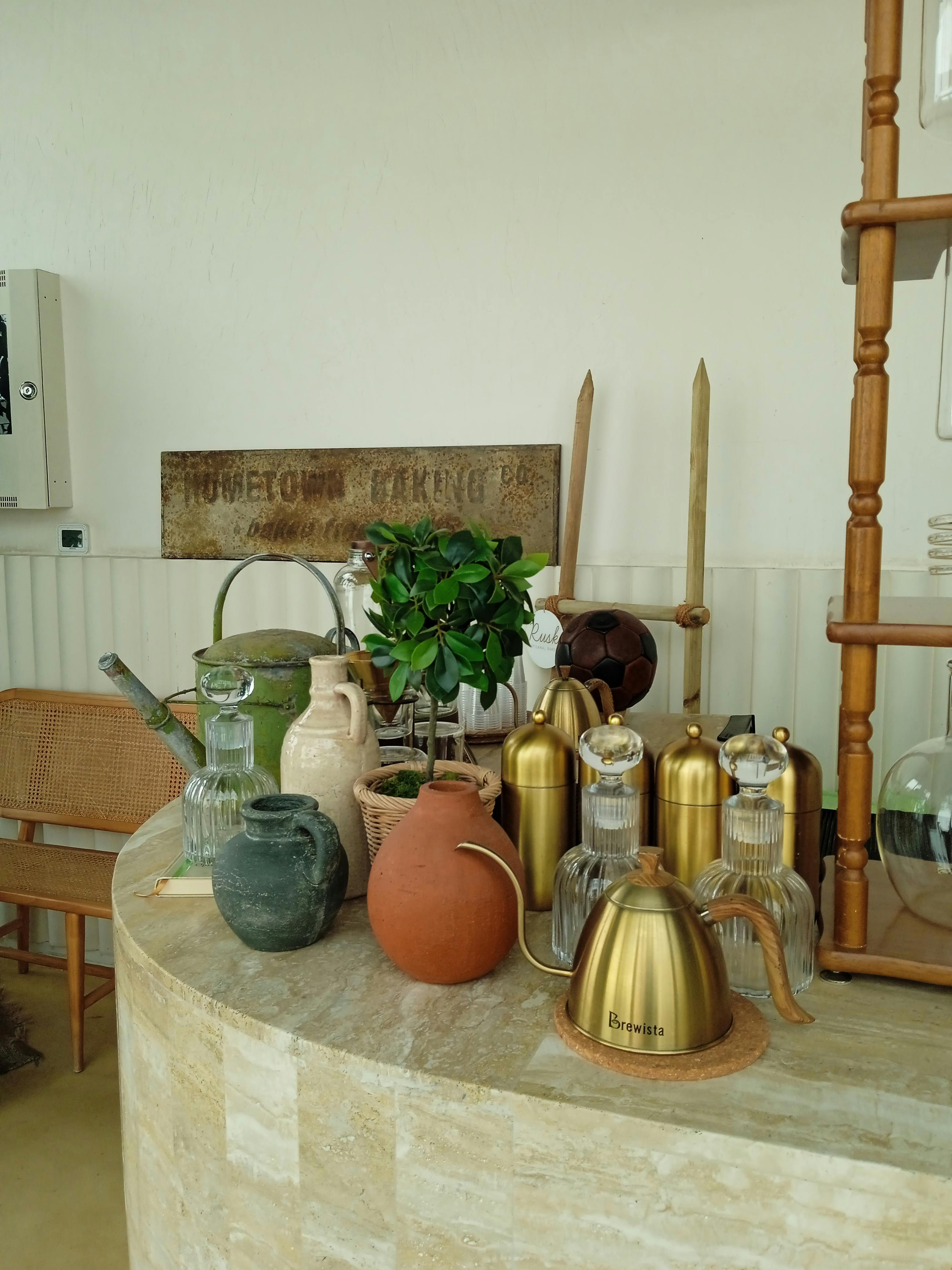 Kettle, Vases and Glasses on Counter · Free Stock Photo