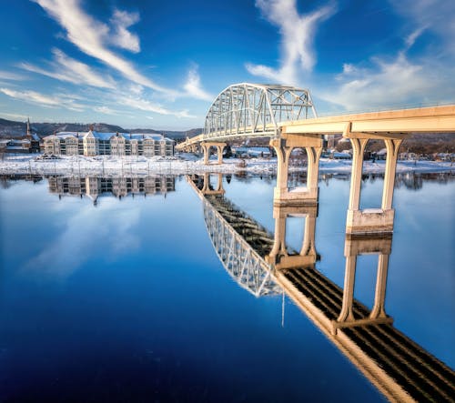 Free Bridge Reflection in River in Winter Stock Photo