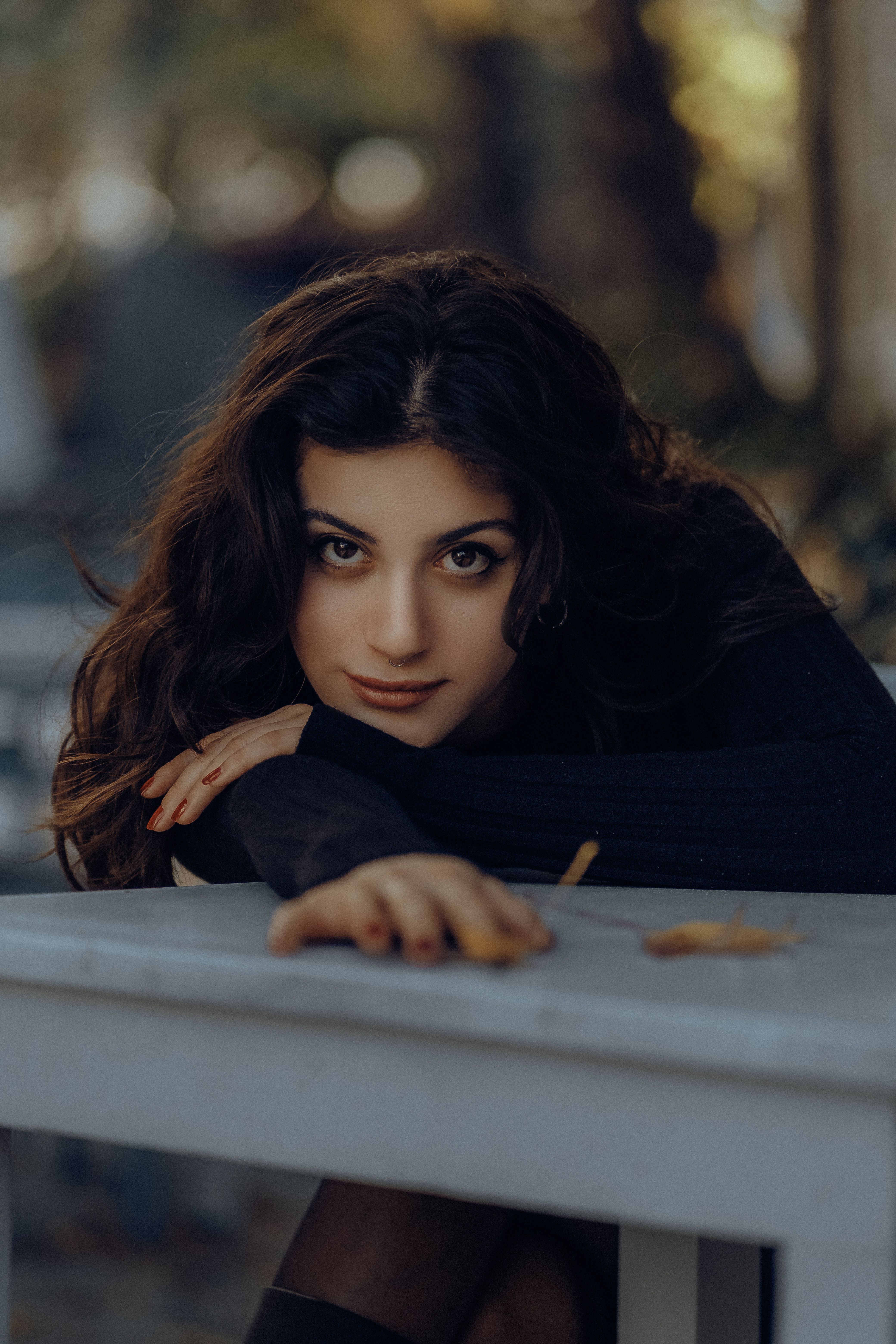 Woman Leaning on Table and Posing · Free Stock Photo