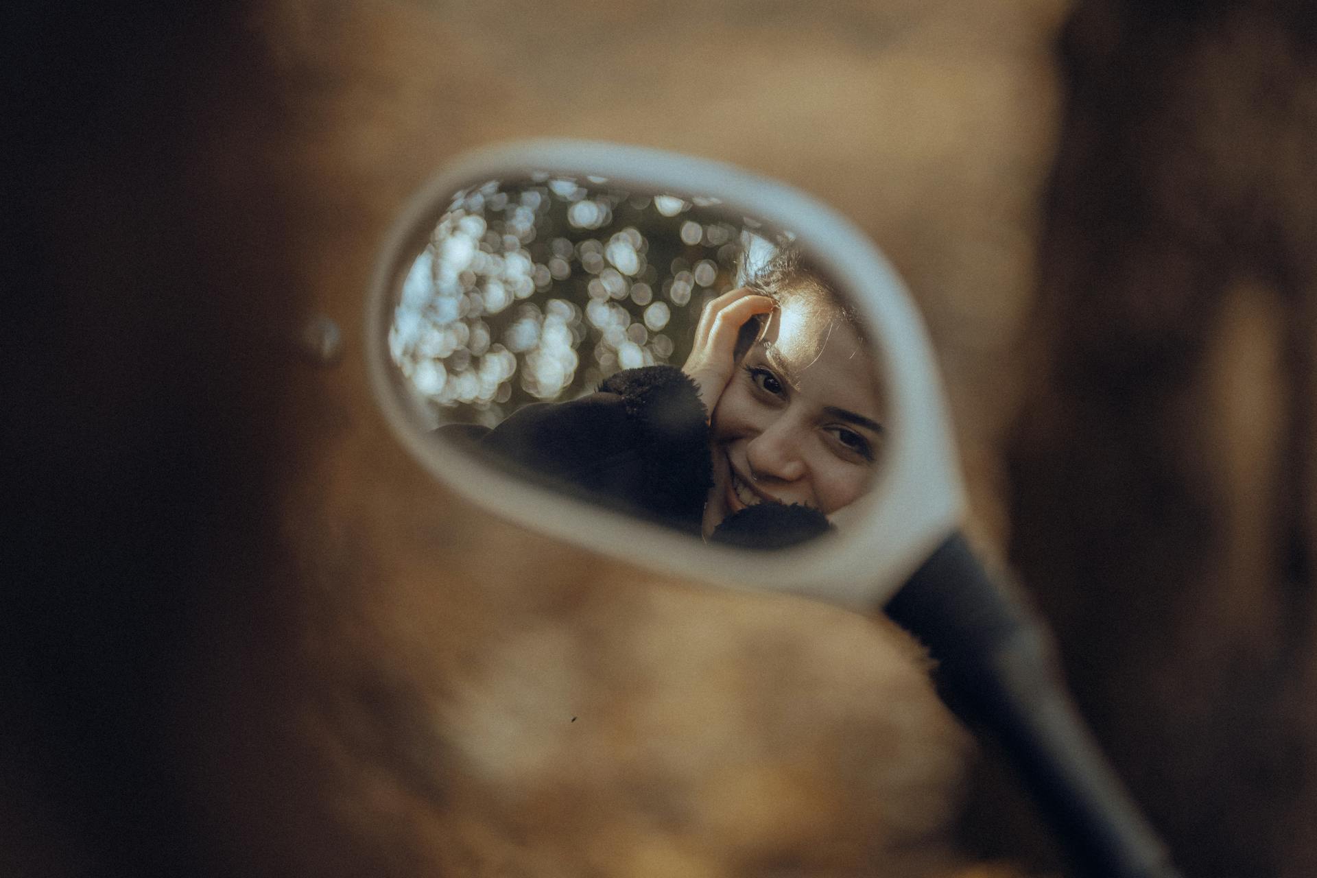 Smiling Woman Face Reflection in Mirror