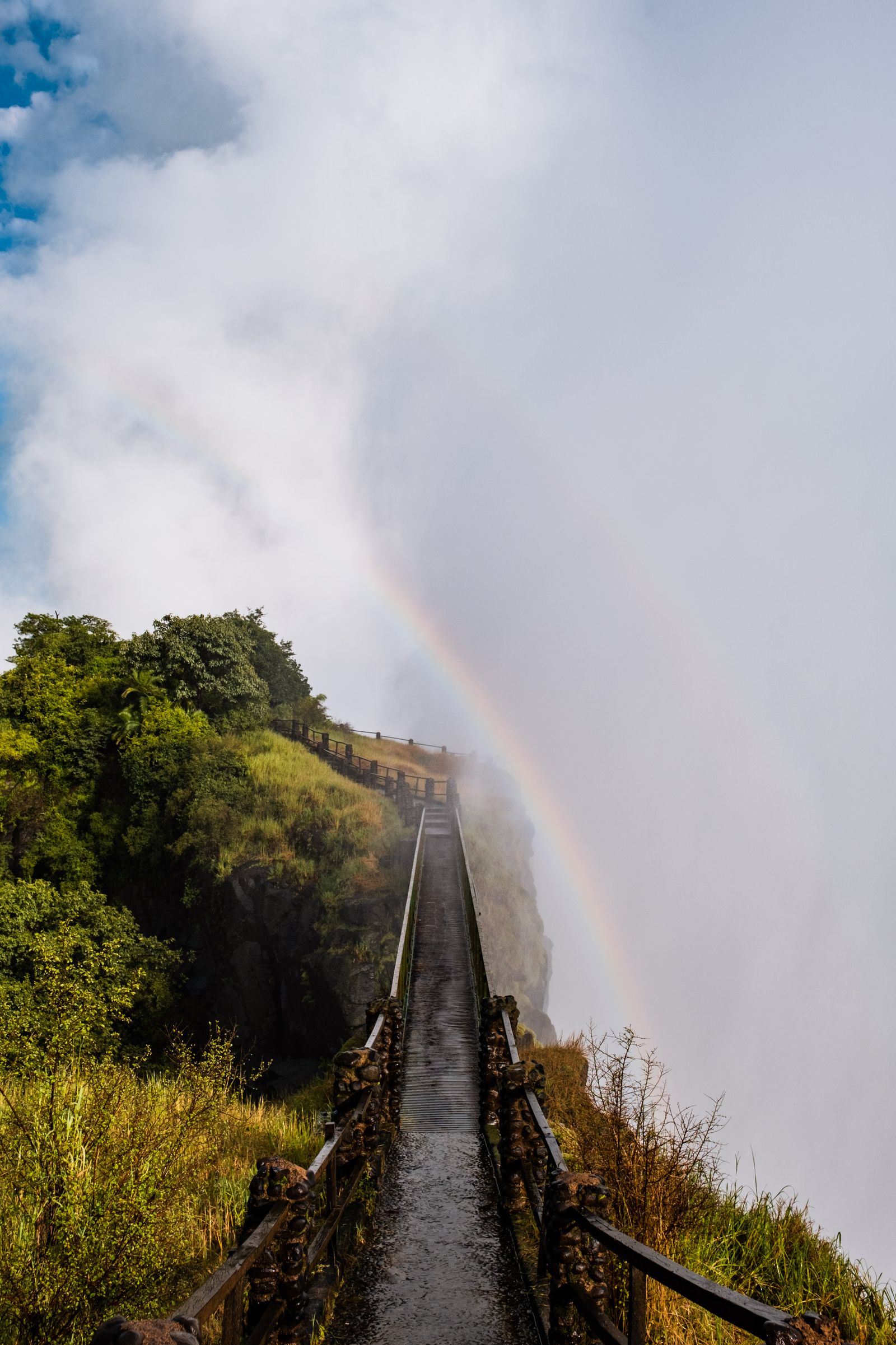 Rainbow over the Victoria Falls Bridge spanning the Zambezi gorge between Zimbabwe and Zambia