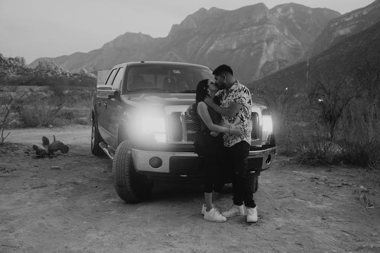 Couple Kissing By Car In Black And White