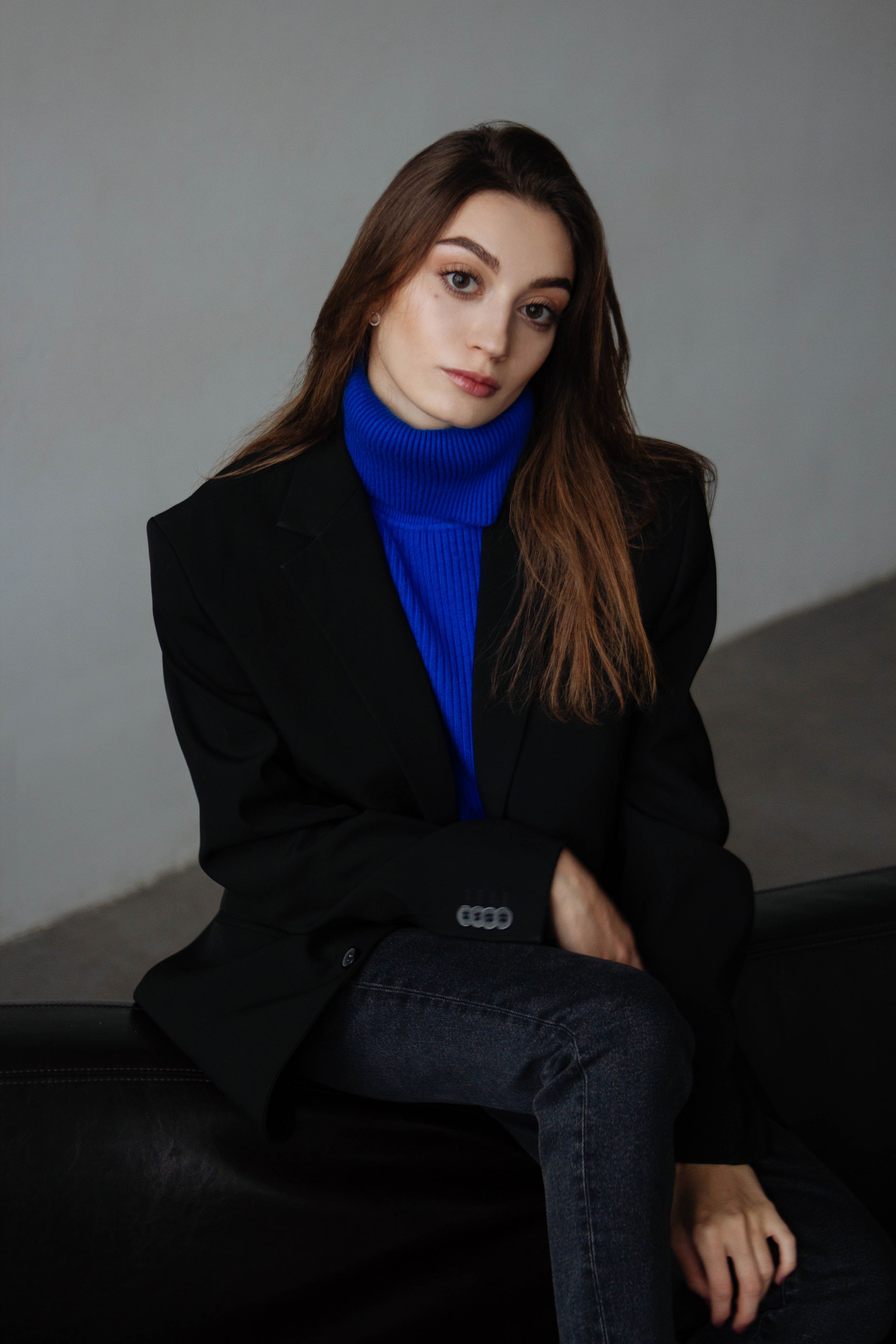 Black blazer with dark barrel jeans and heels