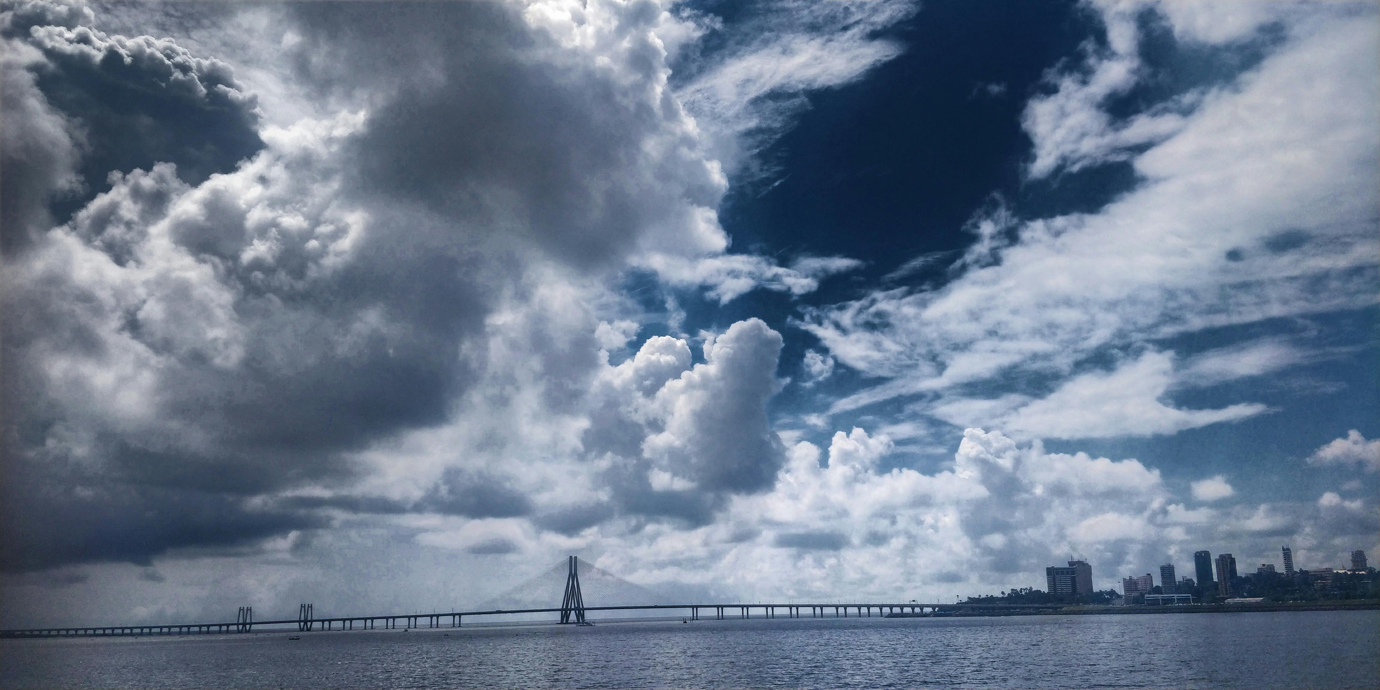 Free stock photo of bridge, cloudy sky, skyline