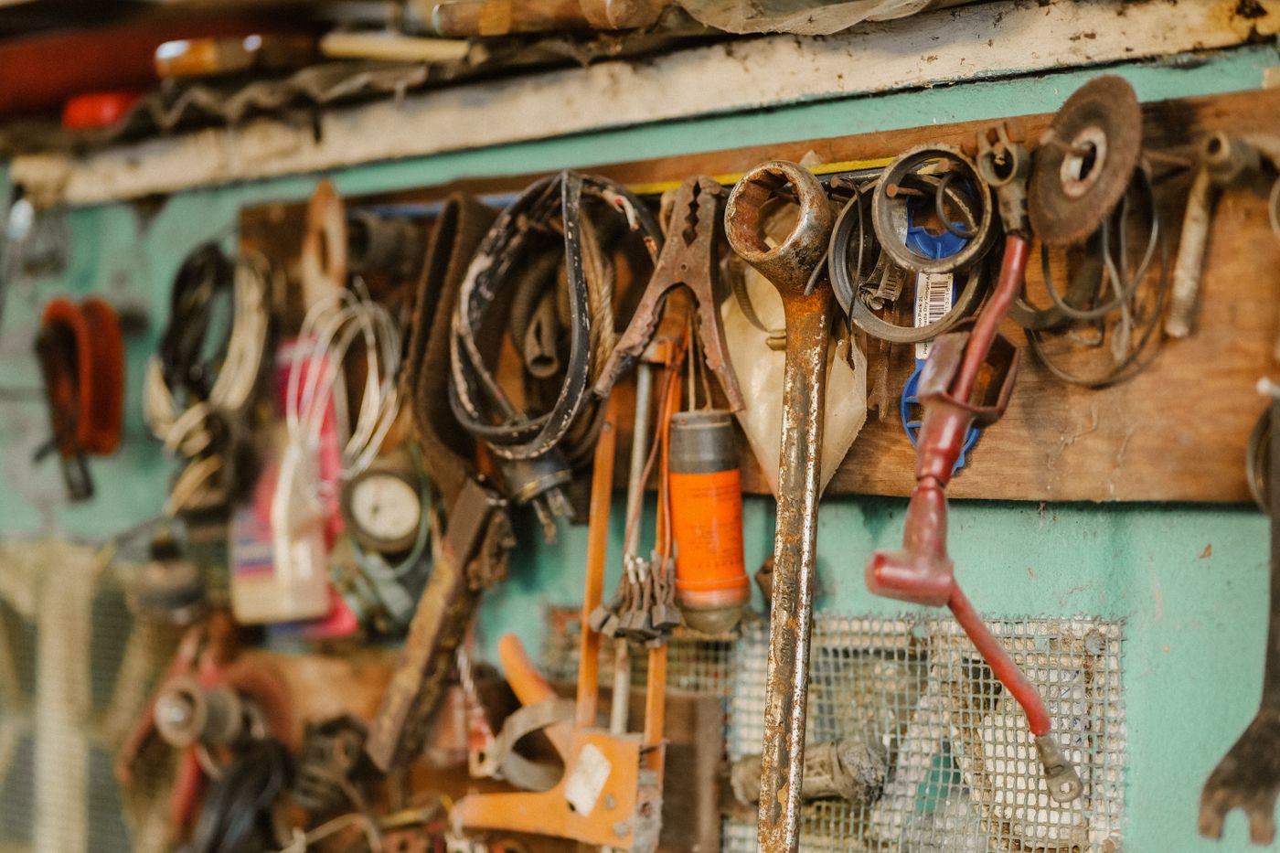 Vintage tools hanging on a workshop wall