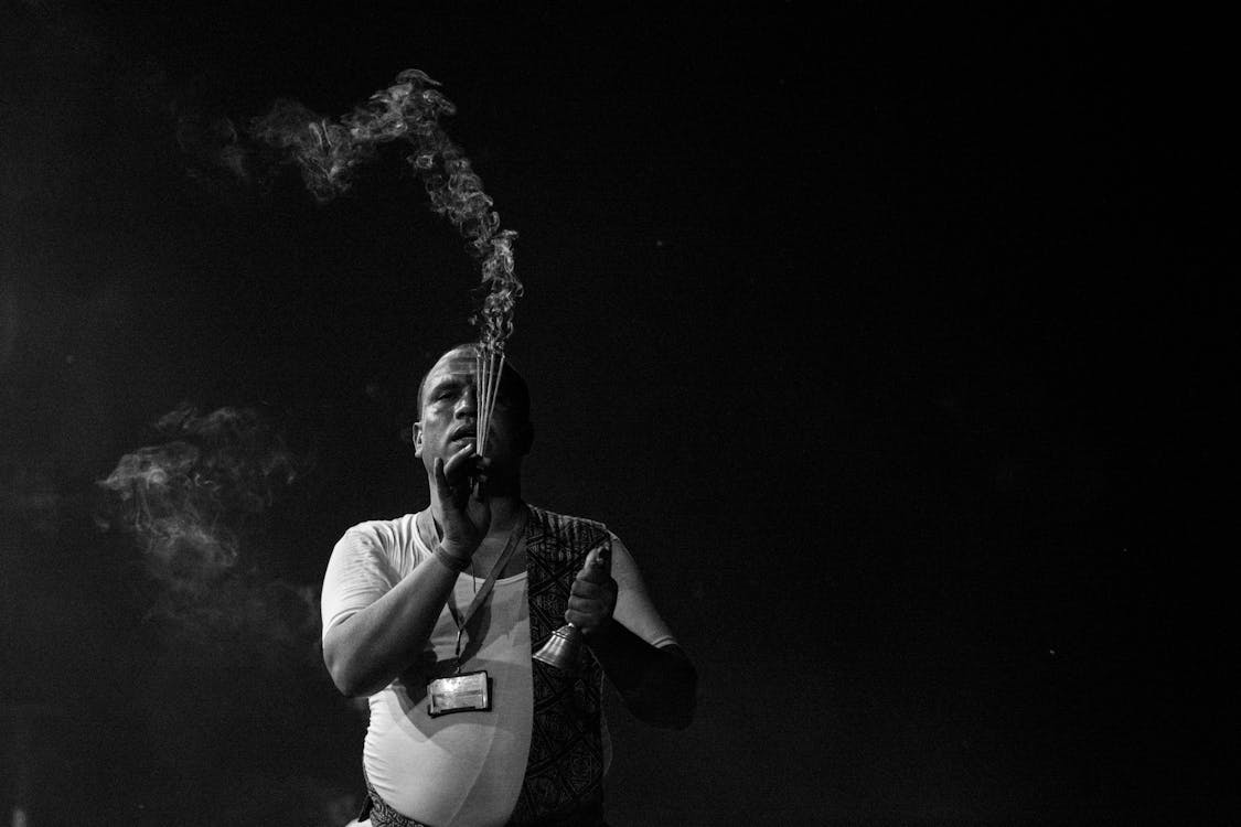 Man Holding Incense