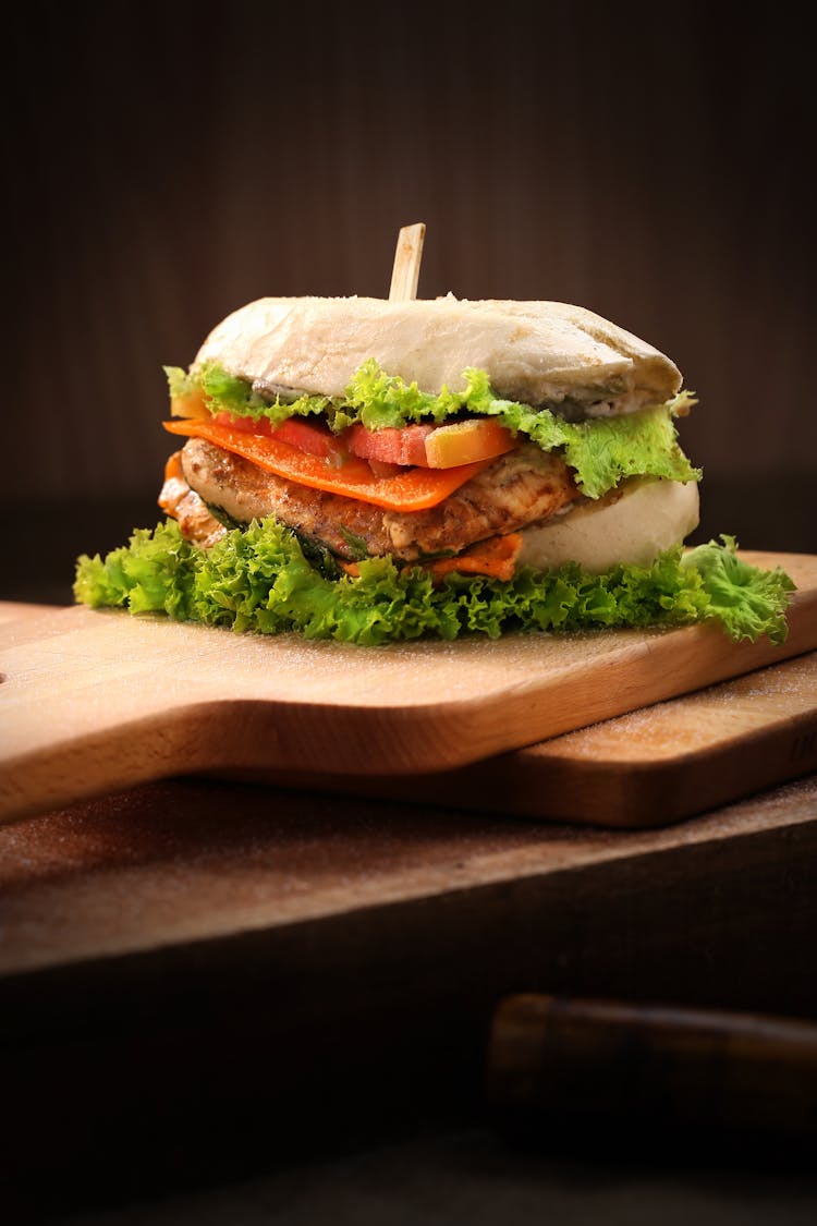 Cheese Burger On Brown Chopping Board