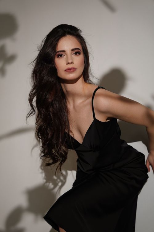 brown hair black dress The Outfit Color to Wear Instead of All-Black Looks