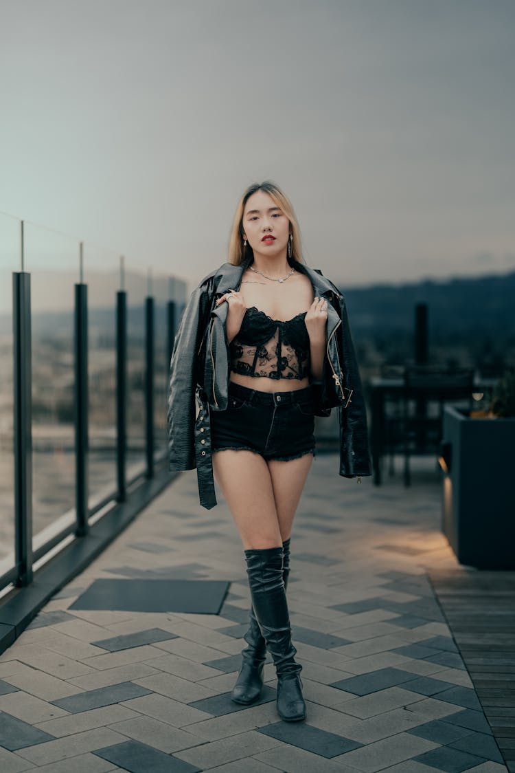 Woman Posing In Jacket And Boots