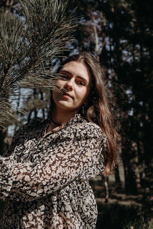 Portrait of Woman with Evergreen Branch