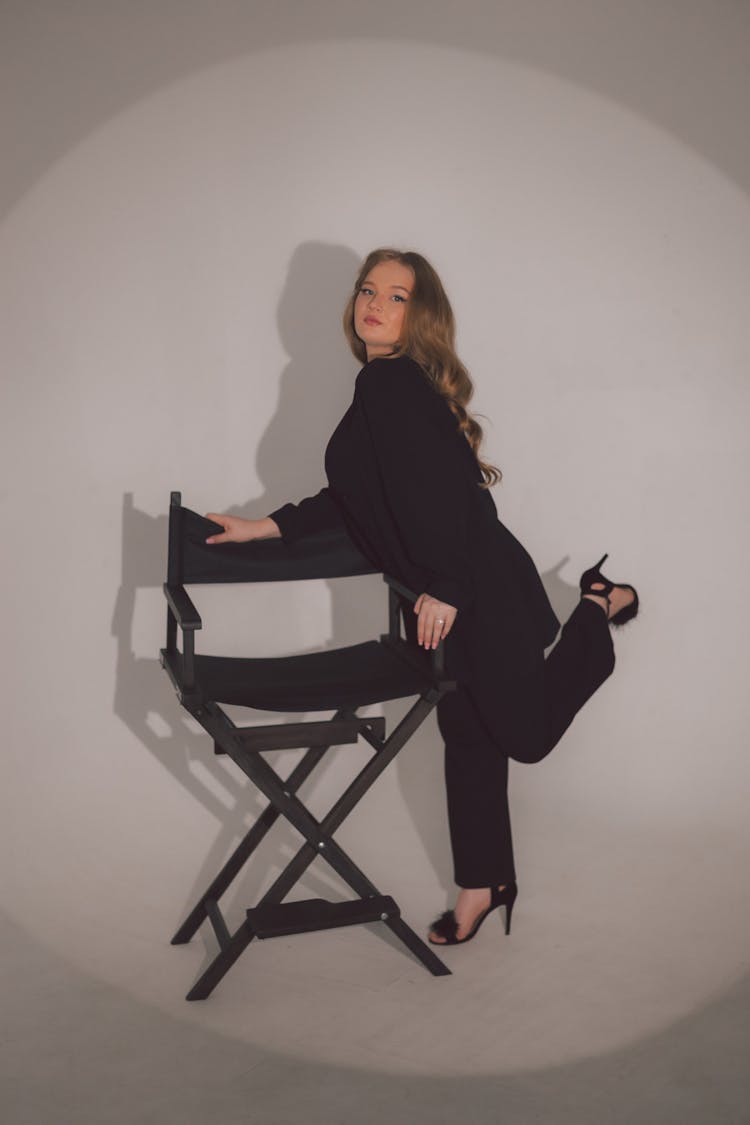 Woman Leaning On A Folding Chair