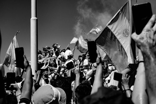 Crowd Protesting with Argentinian Flag