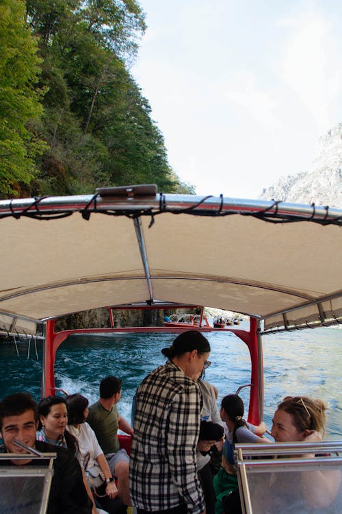 Photo of People Travelling on a Recreational Boat
