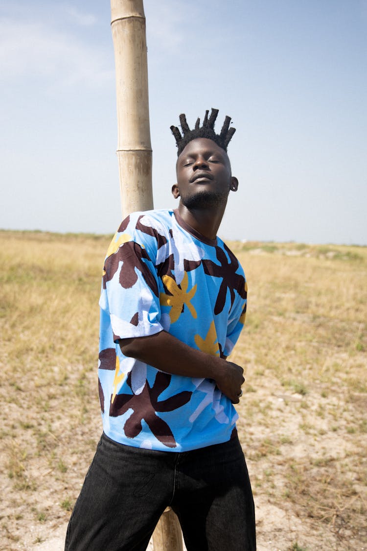 Stylish Man Posing In Field