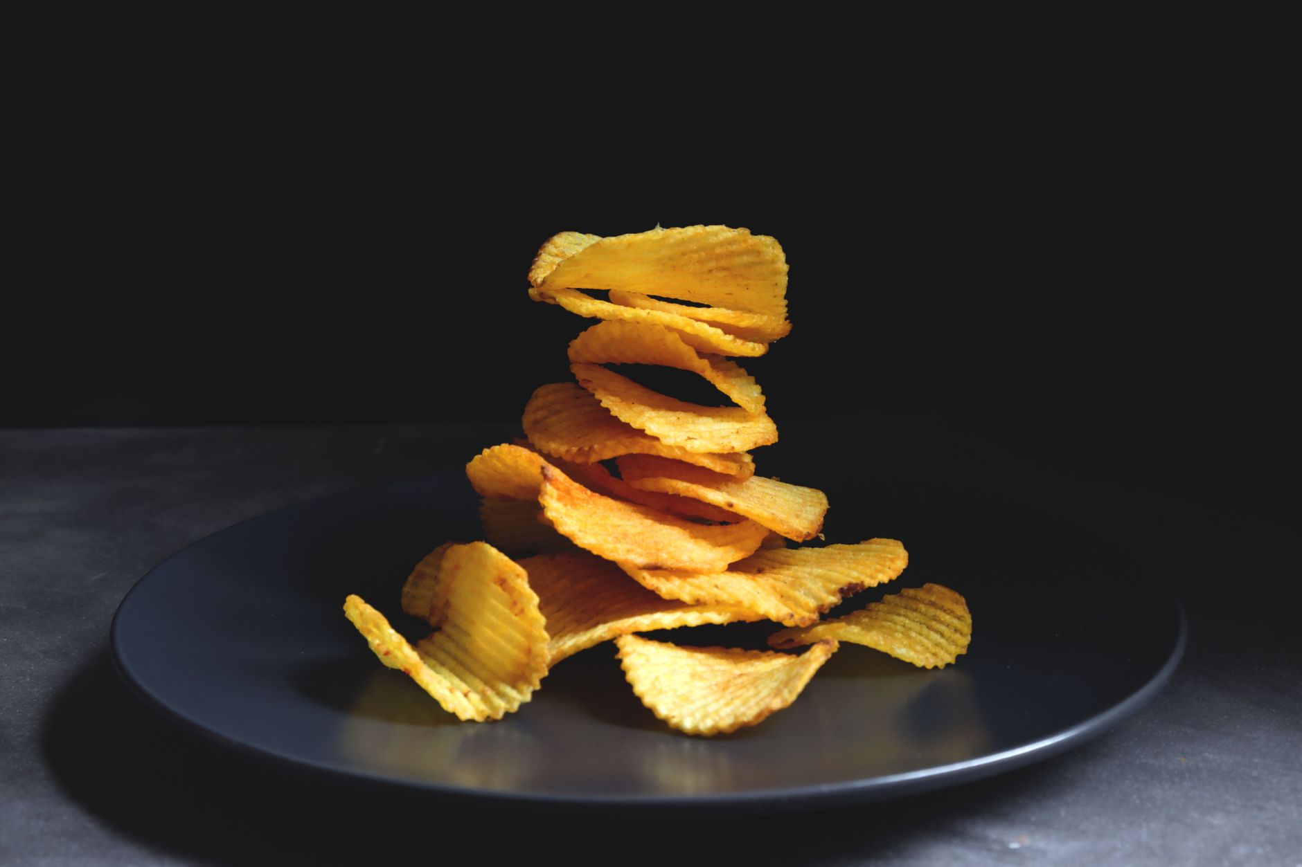 Serving crispy potato stacks topped with parmesan