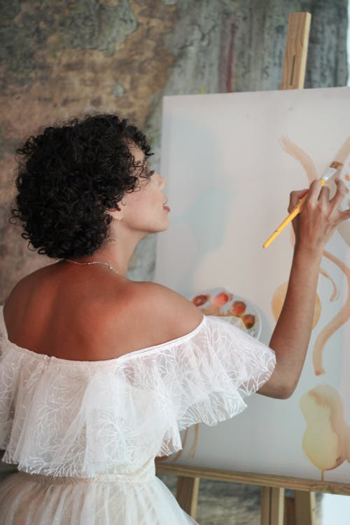Woman in White Dress Standing and Painting