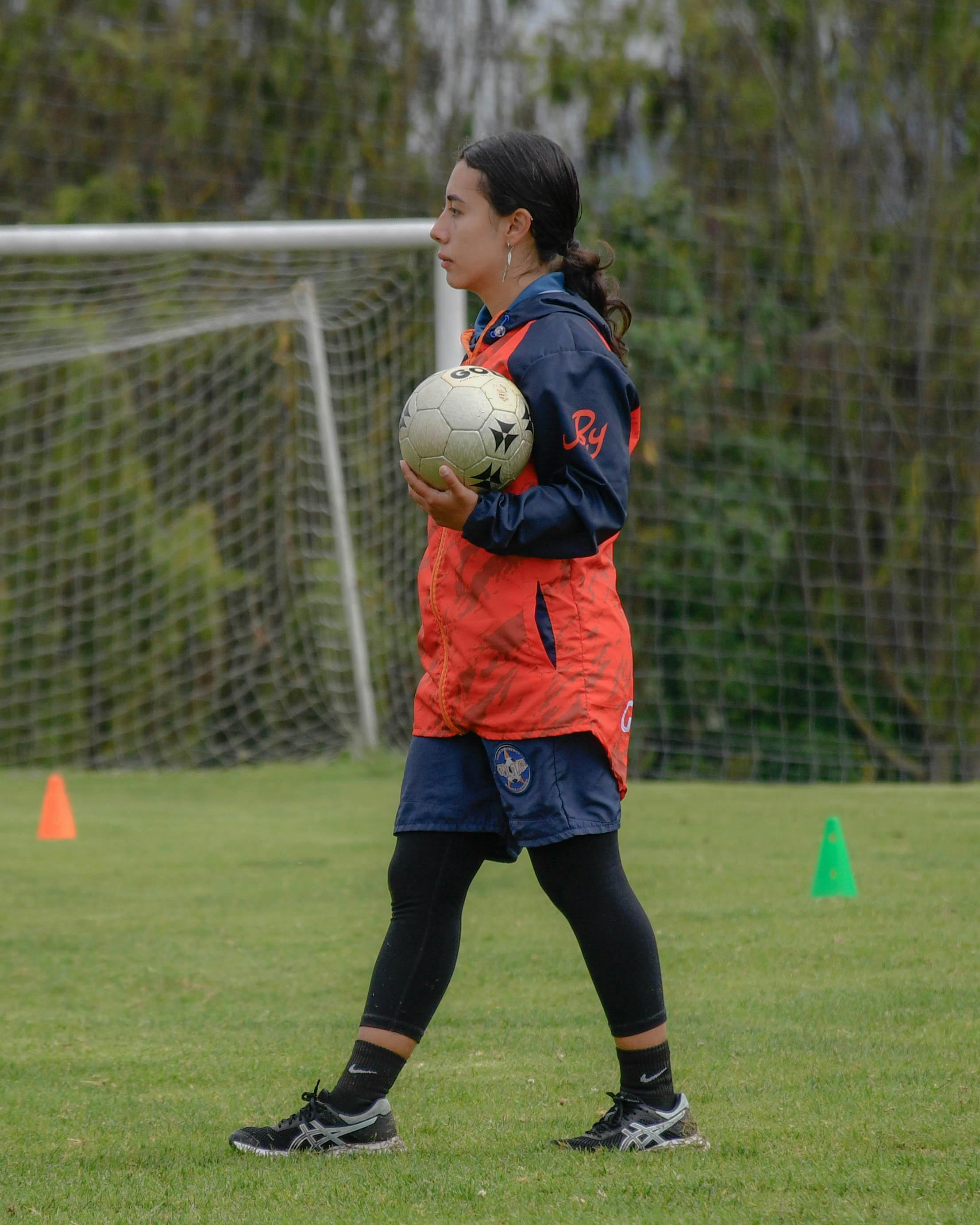 young woman at a soccer training