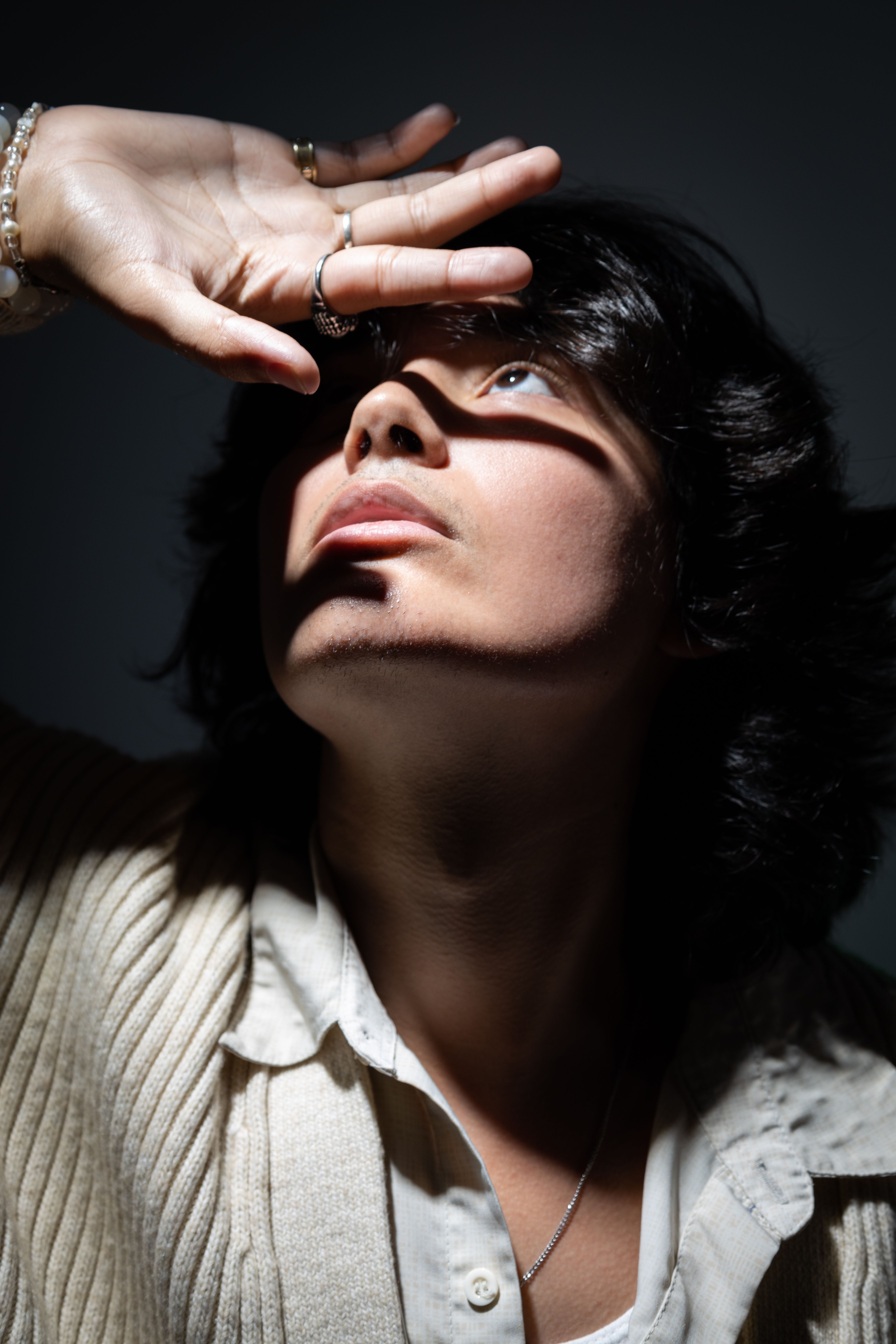 A man with his eyes closed and his hands on his face · Free Stock Photo