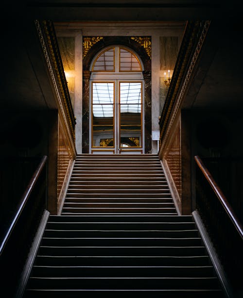 Arched Glass Door by End of Stairs