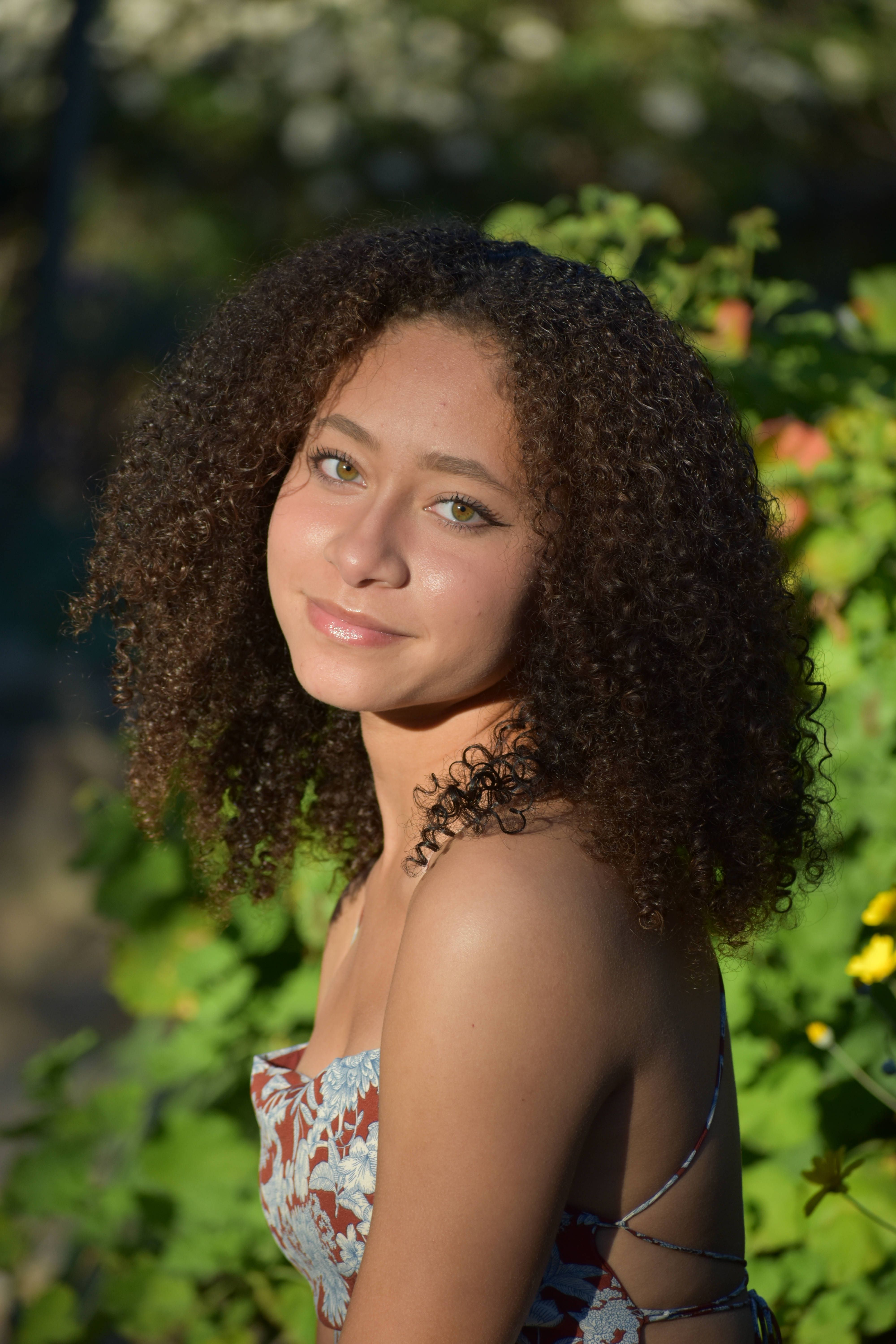 Portrait of Woman with Curly Hair · Free Stock Photo