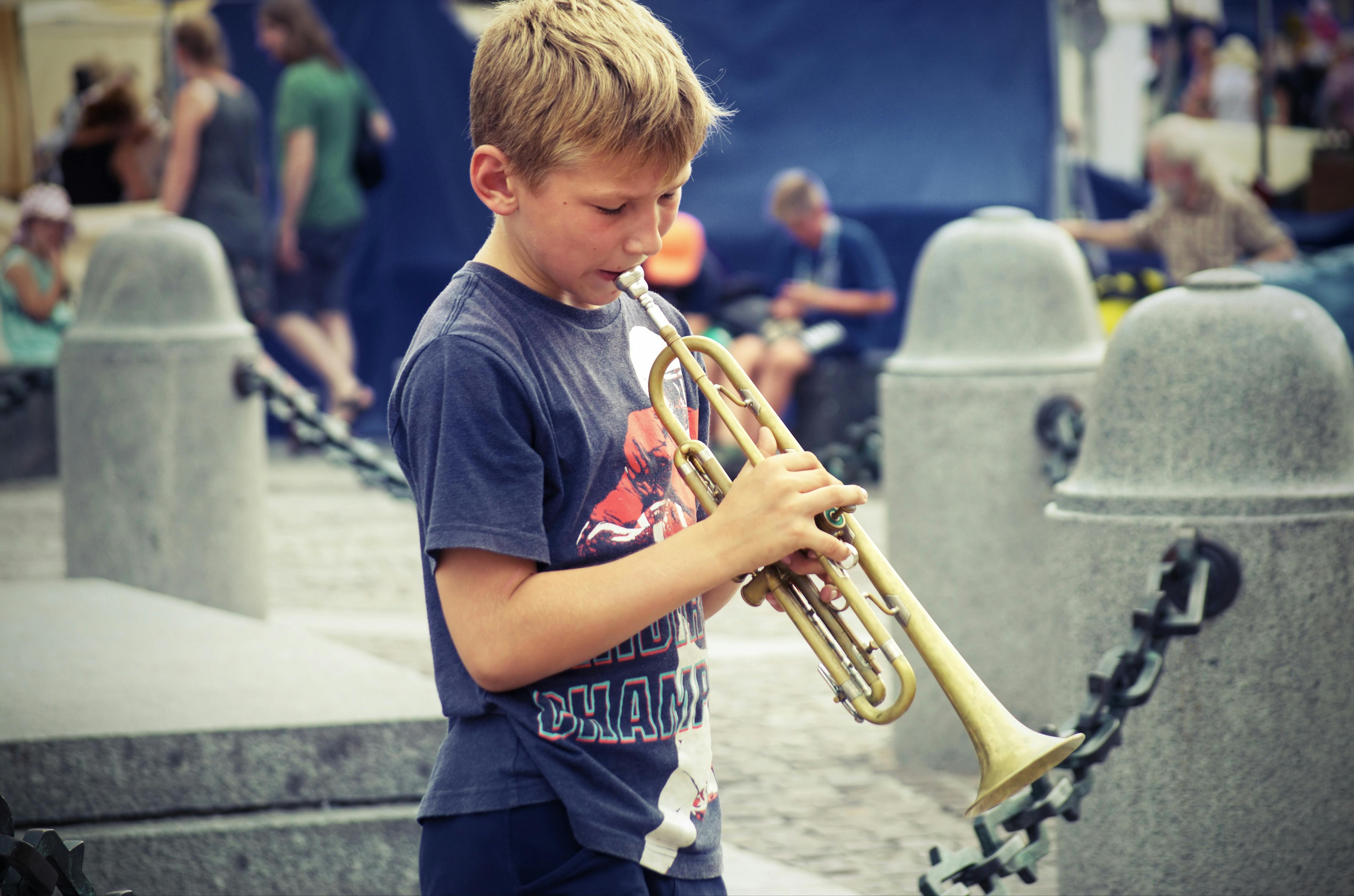 Free stock photo of boy playing a trumpet, show, tourism