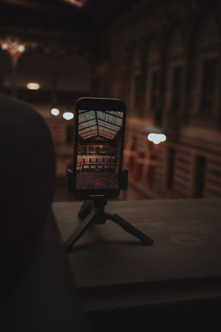 Phone On A Stand With A Picture Of A Museum