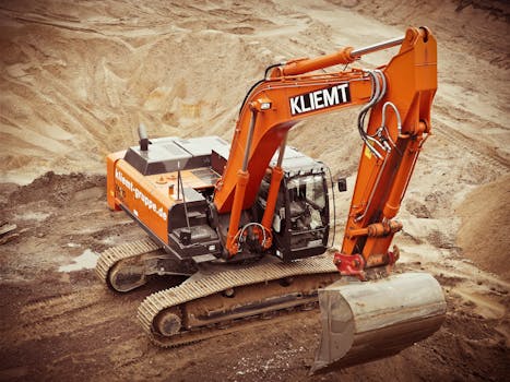 Orange Kliemt Excavator on Brown Soil