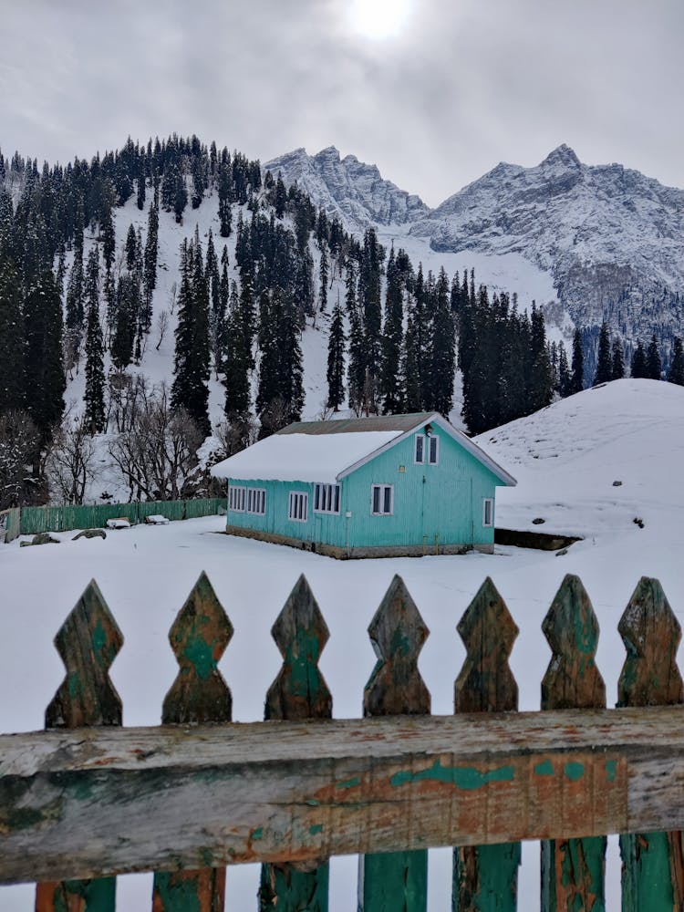 A Lavender House In A Valley Covered In Snow In Gulmarg, Kashmir