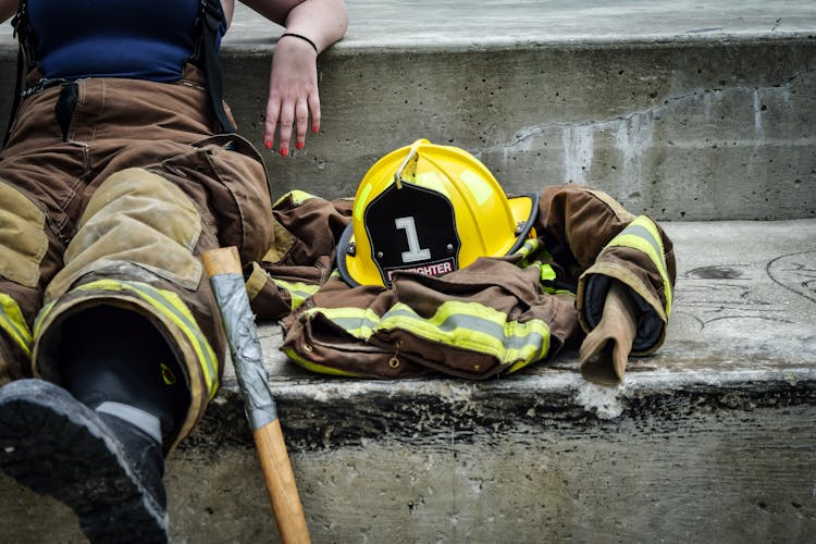 Yellow Hard Hat On Brown And Yellow Fireman's Suit