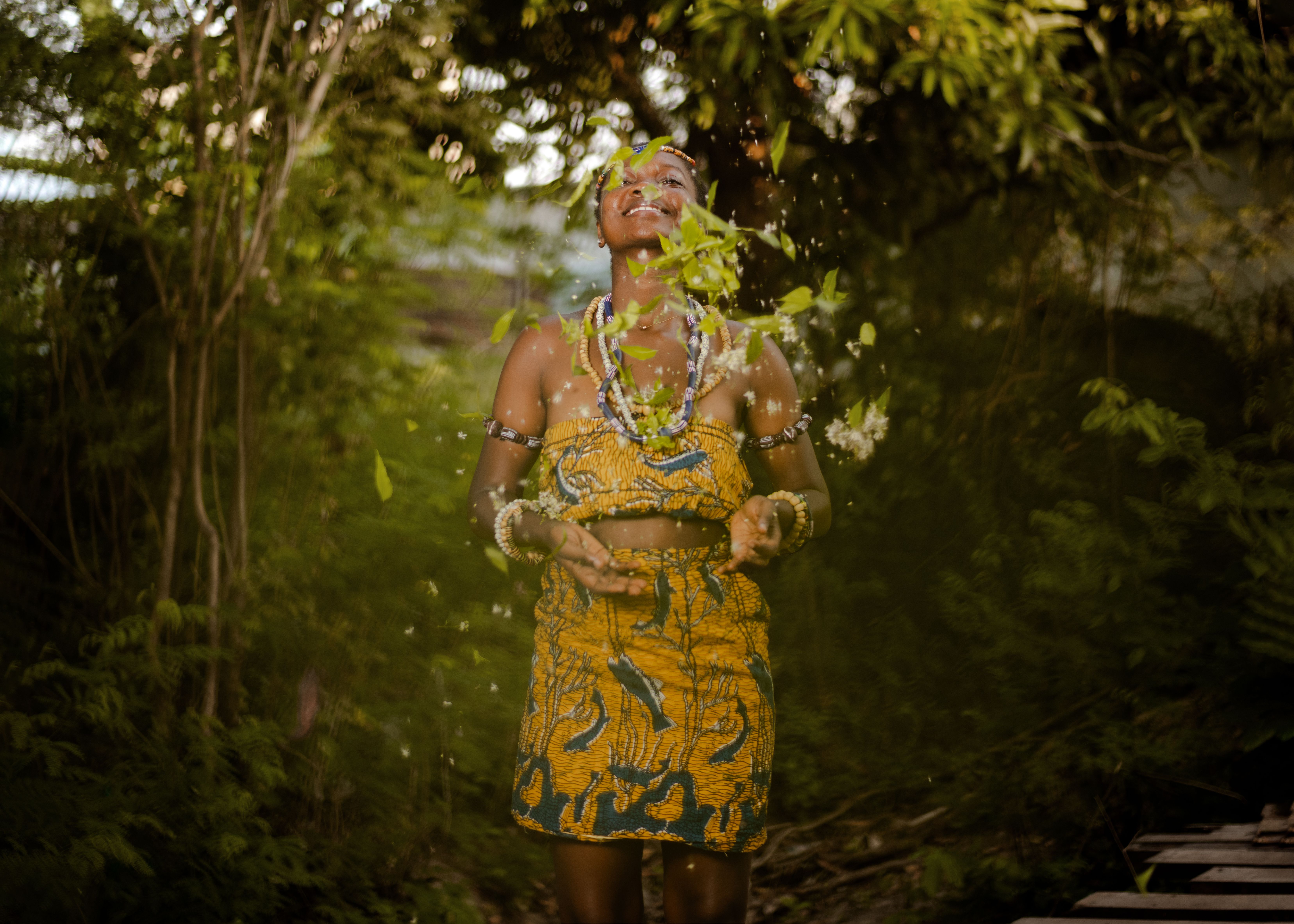 Happy Woman in Yellow Dress Throwing Leaves · Free Stock Photo
