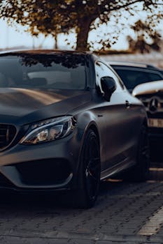 Elegant gray Mercedes-Benz parked outdoors, showcasing luxury design.