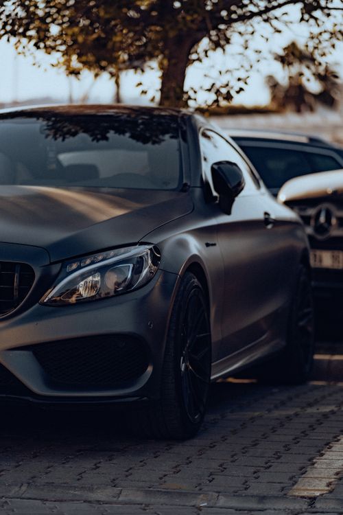 Free Elegant gray Mercedes-Benz parked outdoors, showcasing luxury design. Stock Photo