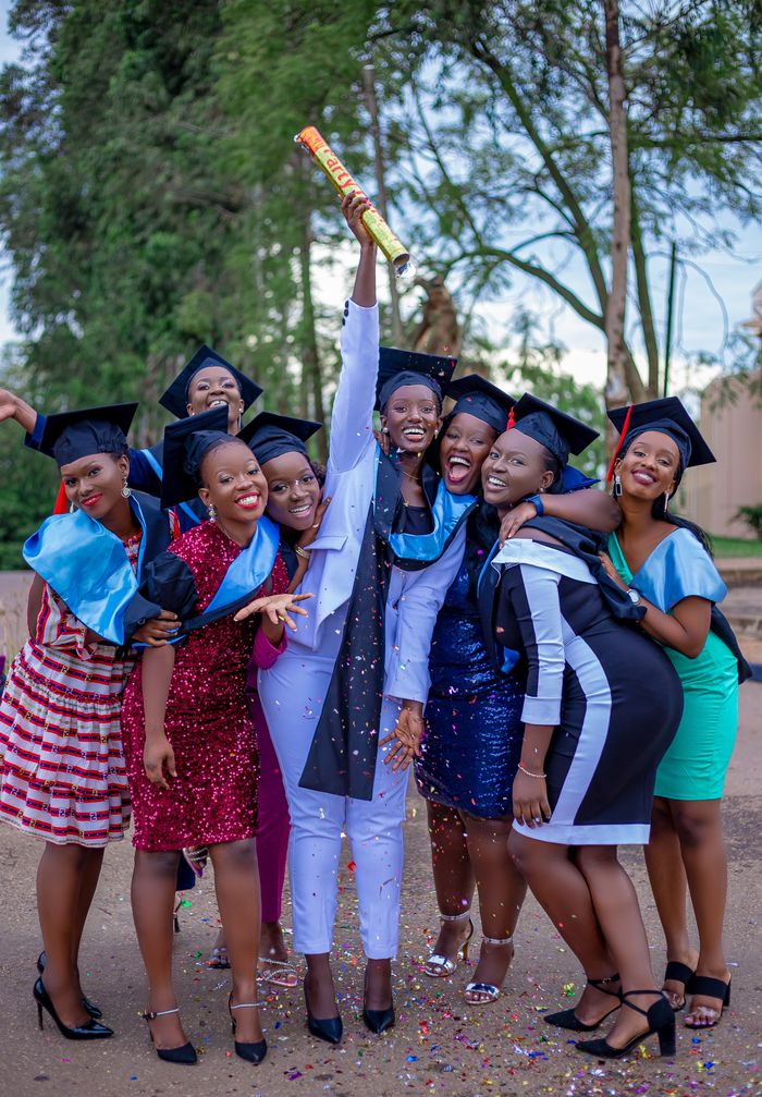 A group of students celebrating a graduation milestone