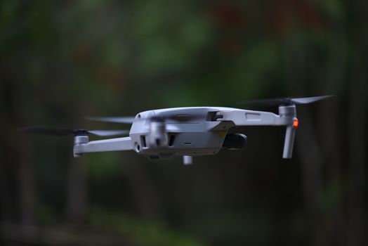 Close-up shot of a modern drone flying outdoors, showcasing technology and innovation.