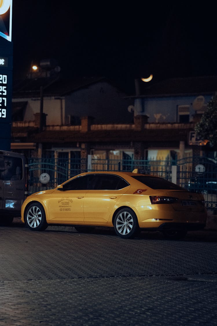 A Yellow Skoda At Night