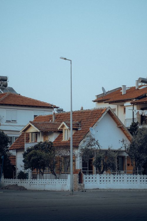 Free Charming traditional houses in Fethiye, Muğla with red-tiled roofs under a clear sky. Stock Photo