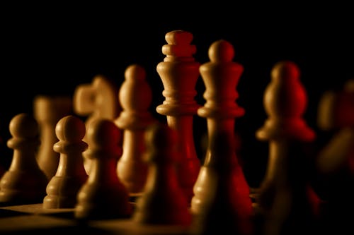 Free White Chess Pieces on Black Bac Stock Photo