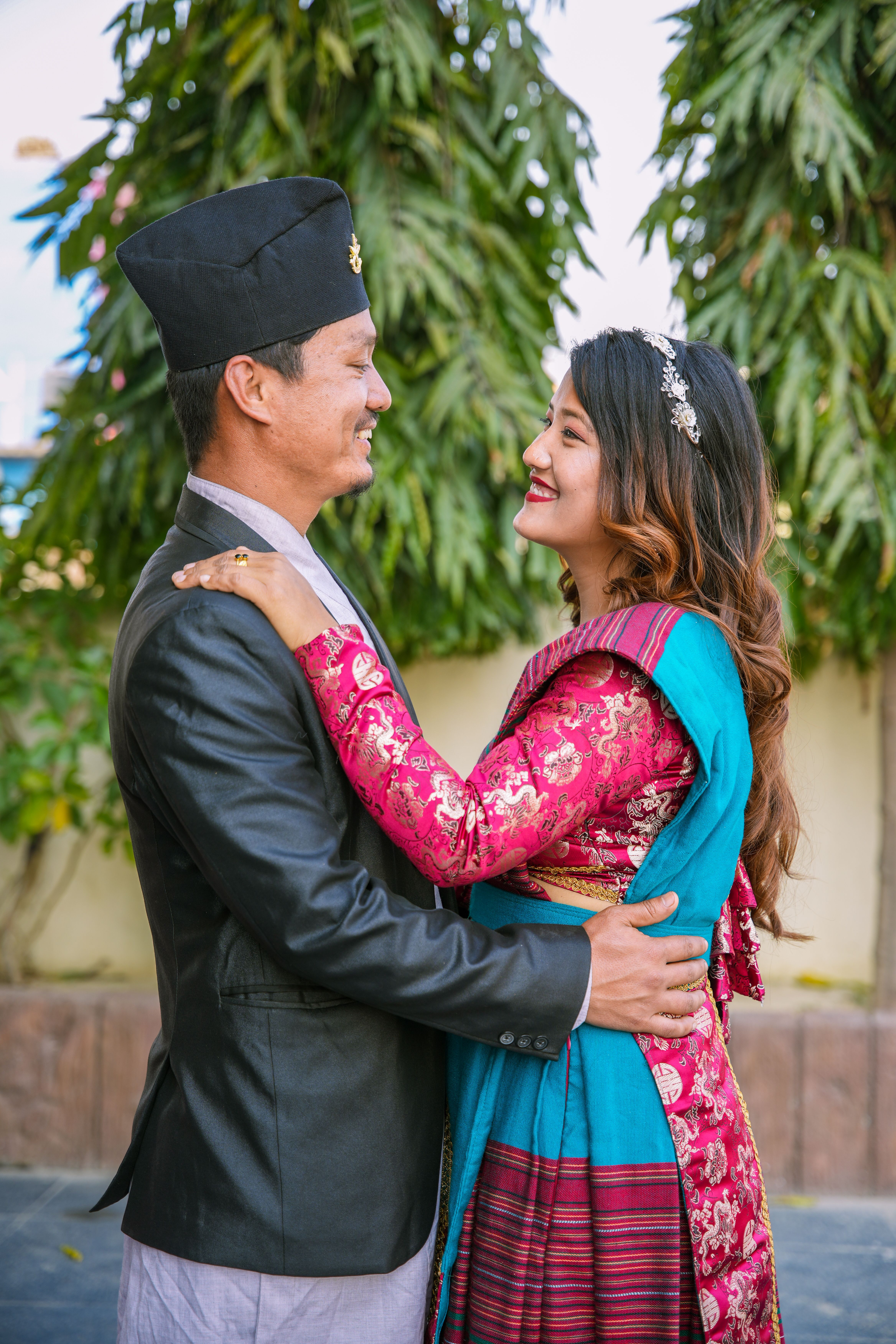 Couple Wearing Traditional Outfits Embracing · Free Stock Photo