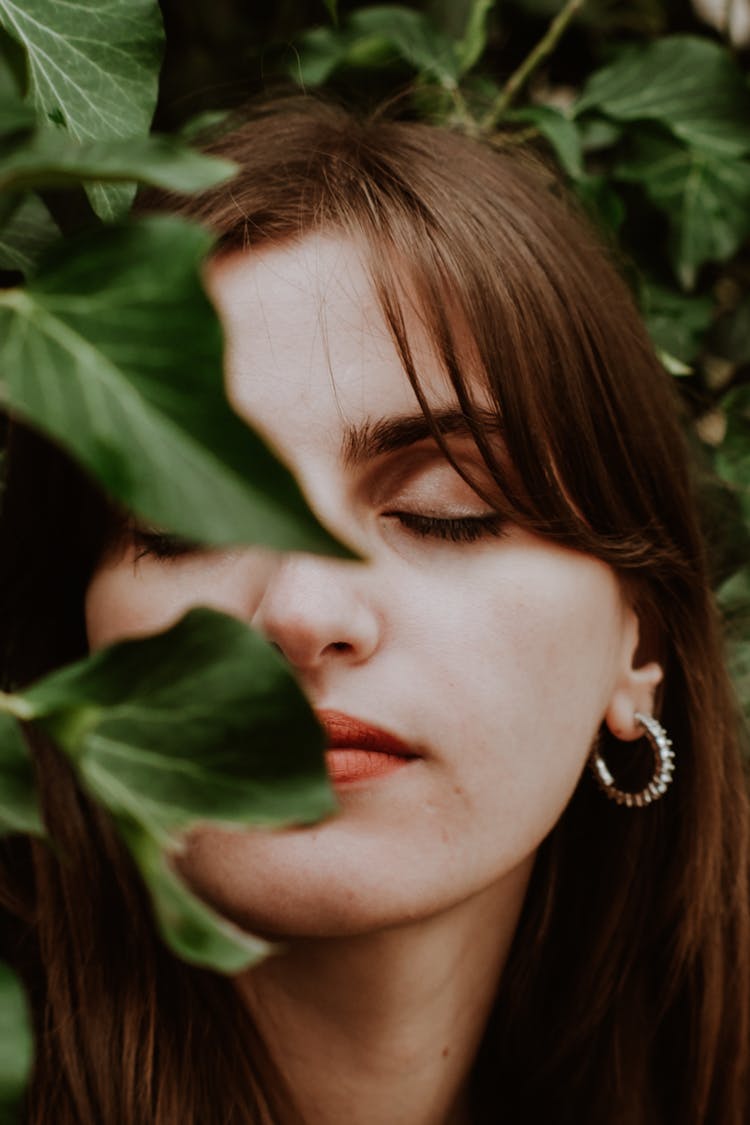 Woman Face Behind Leaves 