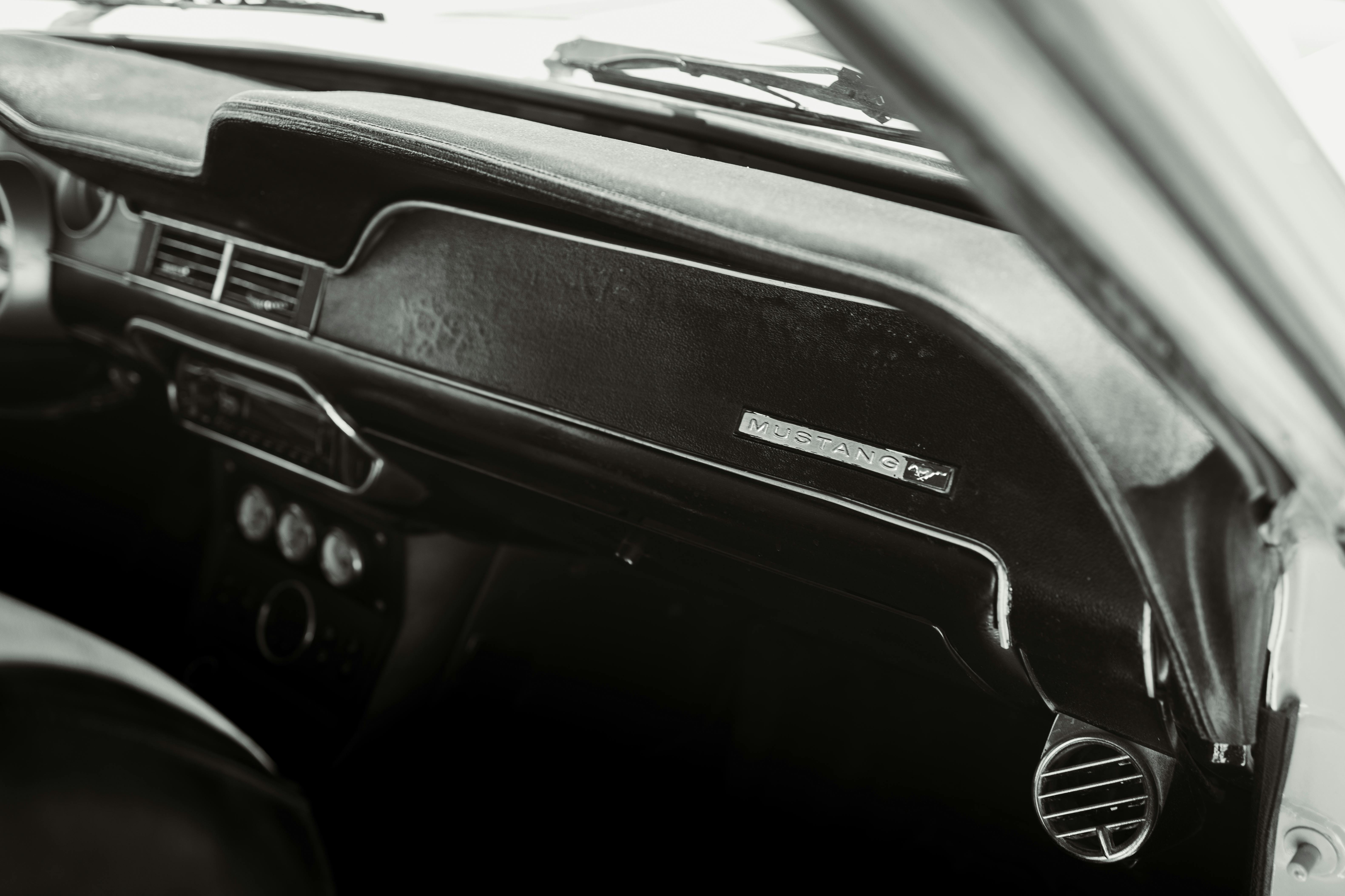 Black and white interior of a classic Mustang car, captured in Los Angeles for automotive enthusiasts.