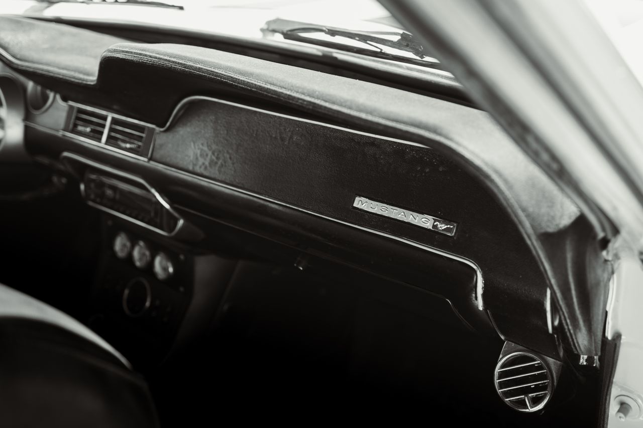 black and white interior of a classic mustang car captured in los ange